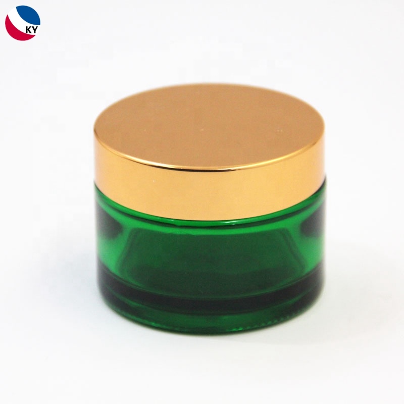 Skincare cream packaging gold coated green frosted glass cosmetic jar