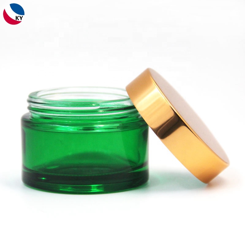 Skincare cream packaging gold coated green frosted glass cosmetic jar