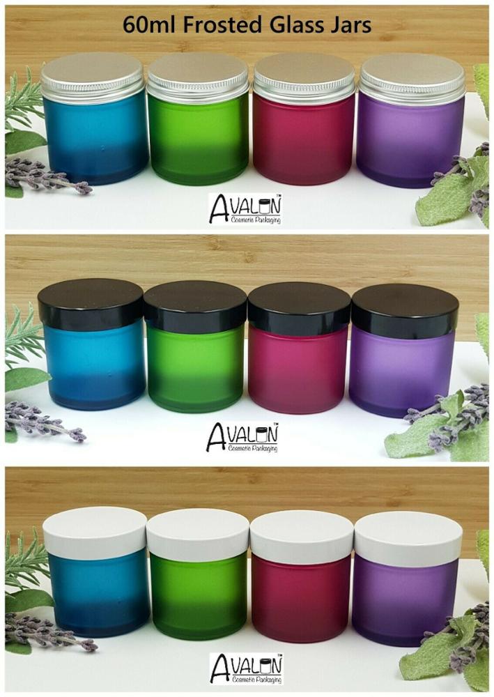 Small frosted green glass cosmetic jars with white lid