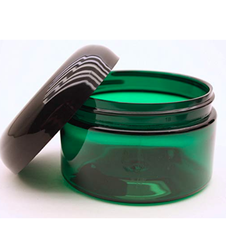 Small frosted green glass cosmetic jars with white lid