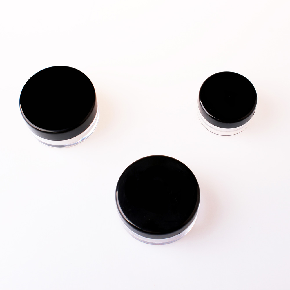 Small round plastic cosmetic containers, loose powder case