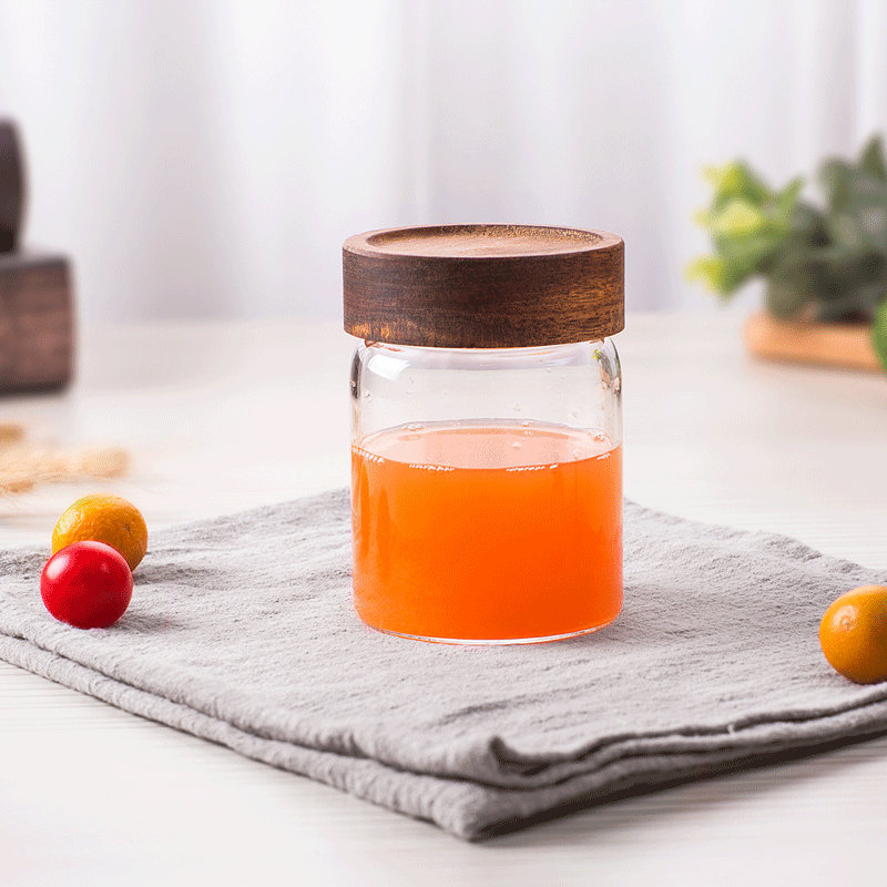 Small transparent jar with spiral mouth with acacia lid