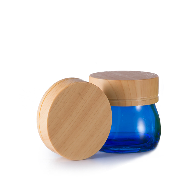 Special design 100 g empty blue cosmetic lotion thick based glass jar container wooden lid for face cream