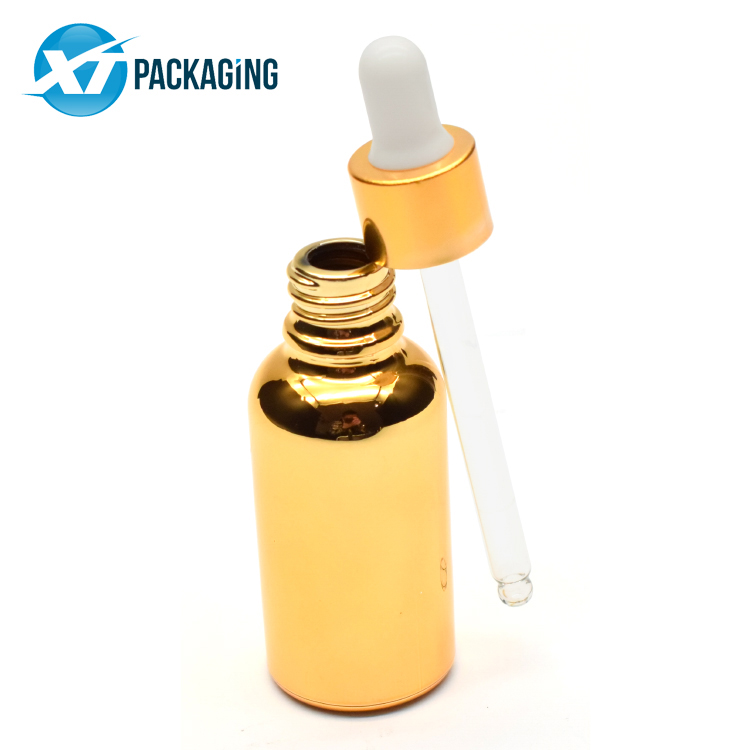 Sprayed gold glass dropper bottle with child resistant lid glass pipette for CBD essential oil