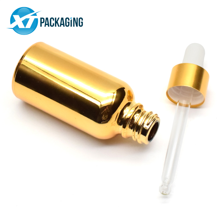 Sprayed gold glass dropper bottle with child resistant lid glass pipette for CBD essential oil