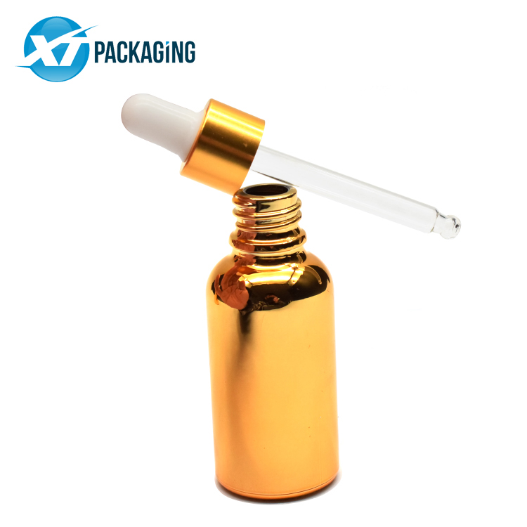 Sprayed gold glass dropper bottle with child resistant lid glass pipette for CBD essential oil