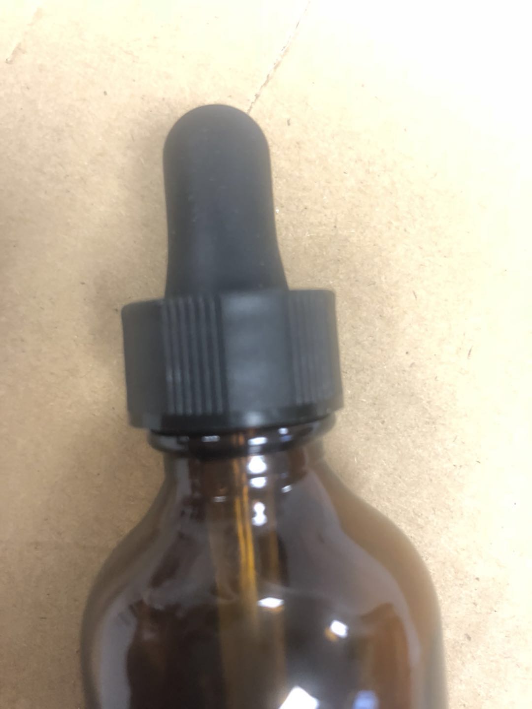Stock amber brown 2 oz 60ml glass dropper bottle with black matt glass dropper