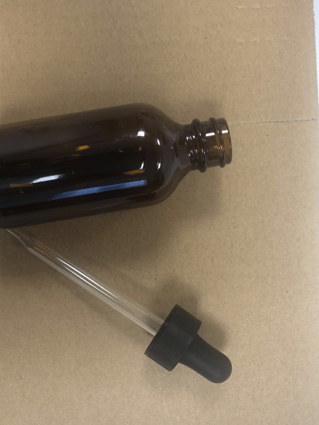 Stock amber brown 2 oz 60ml glass dropper bottle with black matt glass dropper