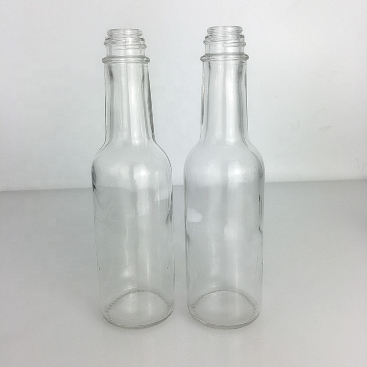 Stock cheap 150ml 5oz clear glass sauce woozy bottle with black screw lid and insert