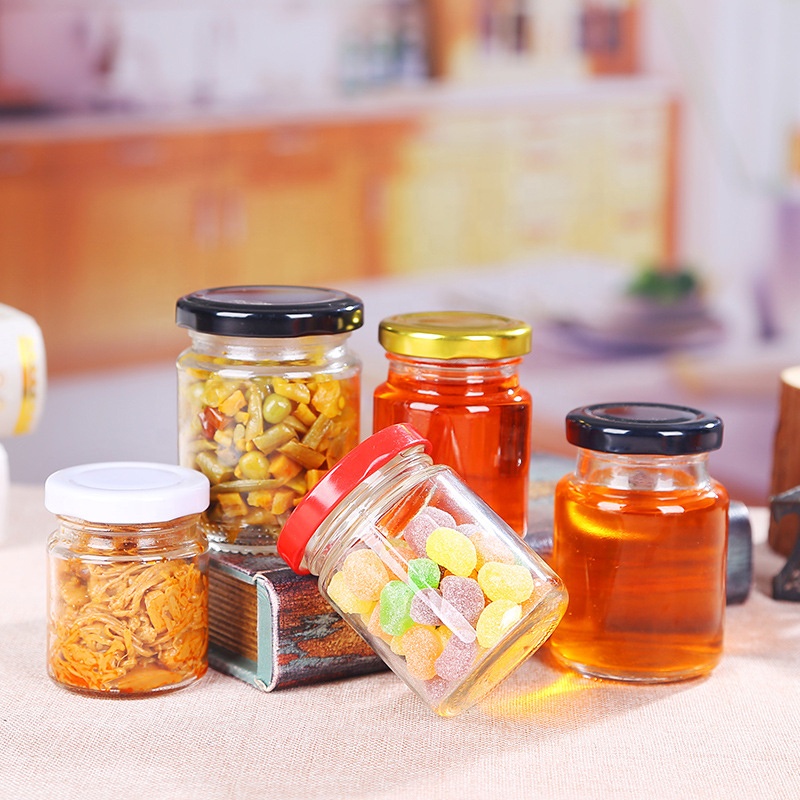 Stock food packaging glass jar round shaped glass jar with metal lid for honey