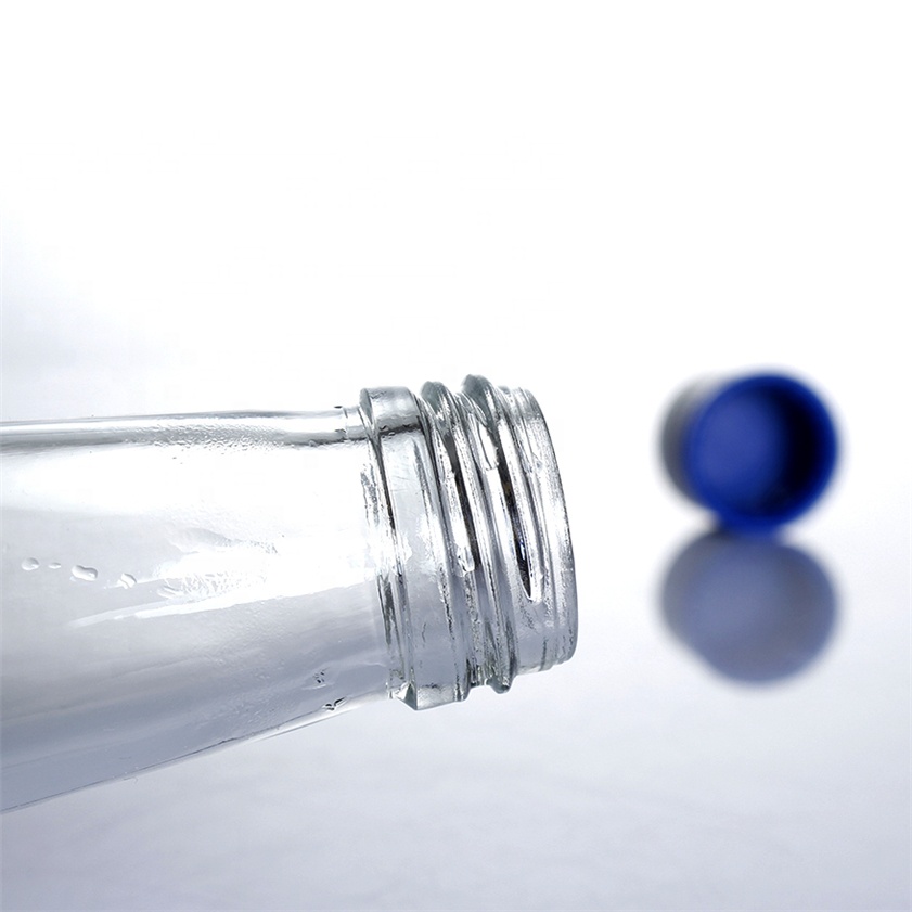 Stocked 330ml 33cl round clear transparent juice water wine spirit glass bottle with screw cap glass manufacturing plant
