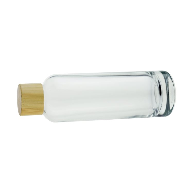Stocks 100ml clear glass bottle with bamboo cap for oil, toner, lotion