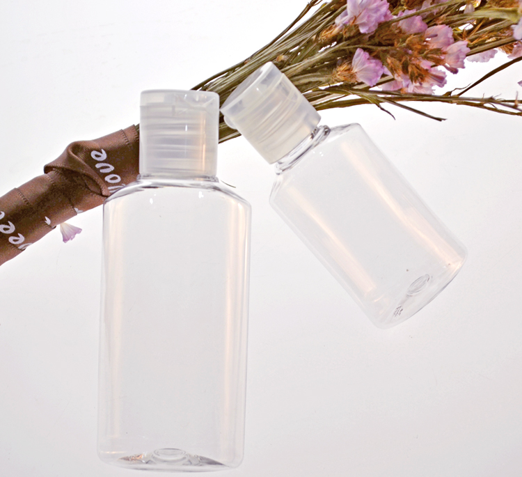 Stocks ready to ship small portable Clear empty 60ml disinfectant gel bottle with flip top cap