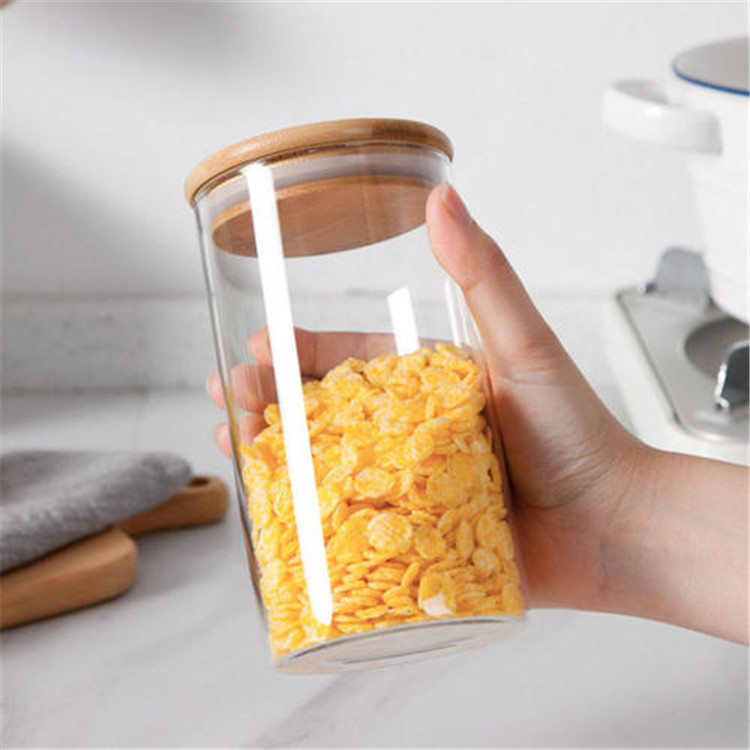 Supply high borosilicate glass storage jar airtight canister container with bamboo wooden press lid for food candy cookie honey