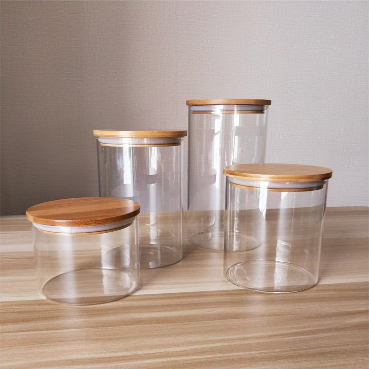 Supply high borosilicate glass storage jar airtight canister container with bamboo wooden press lid for food candy cookie honey