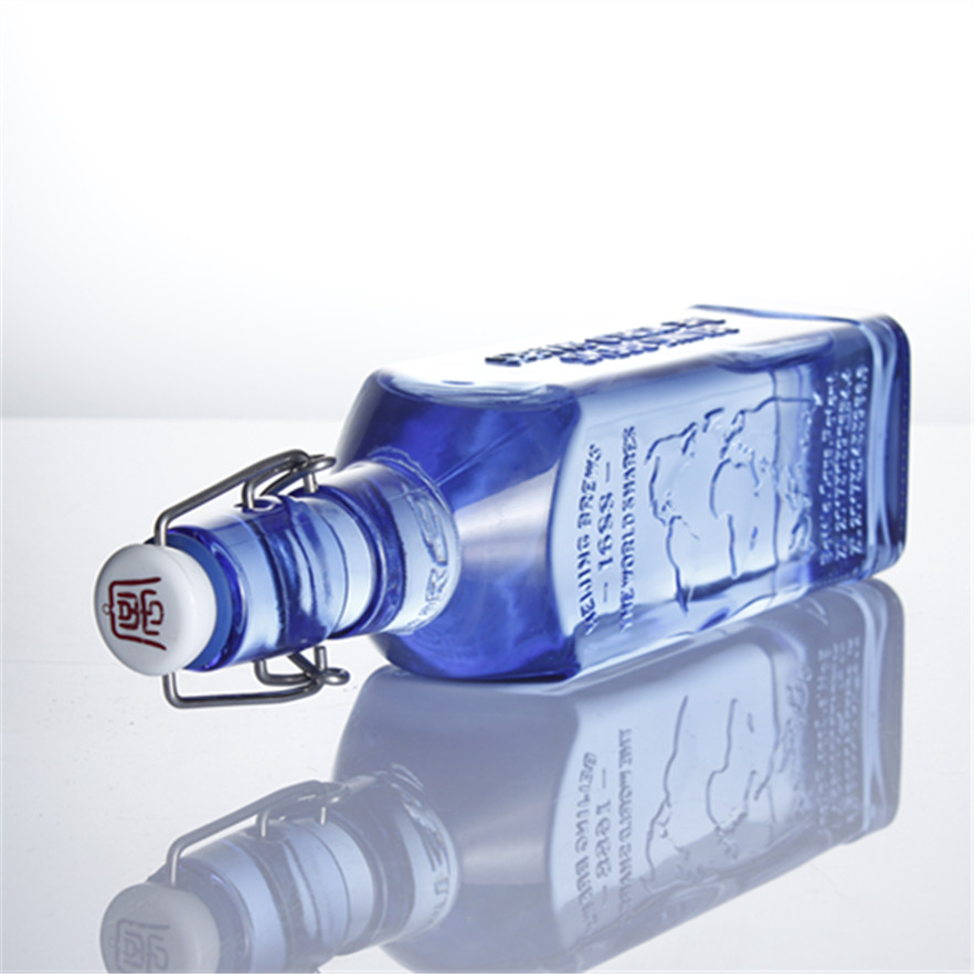 Swing cap 500ml 750ml transparent square engraved spirits beverage glass bottles