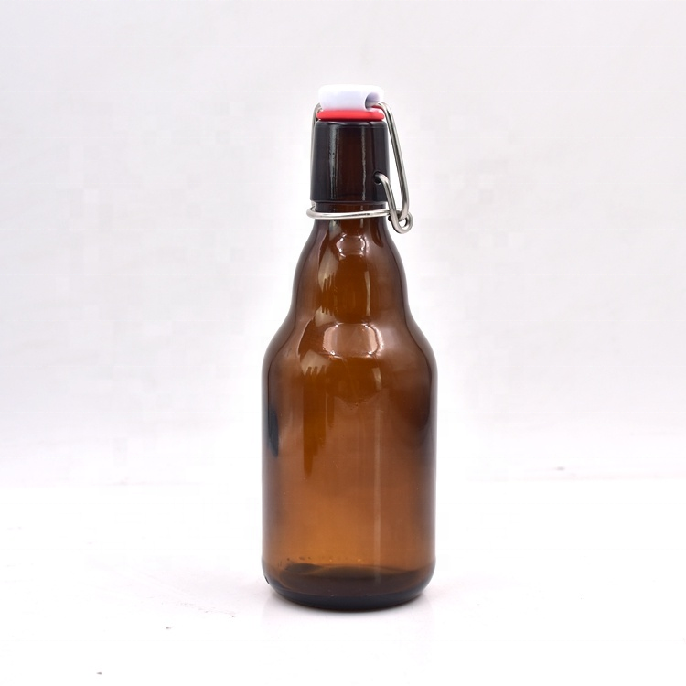 The factory direct sale 330ml 12 oz spot brown beer bottle buckle transparent glass bottle beverage bottle can be customized
