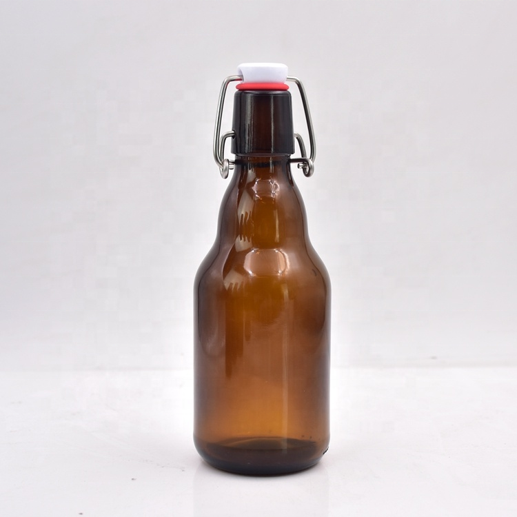 The factory direct sale 330ml 12 oz spot brown beer bottle buckle transparent glass bottle beverage bottle can be customized