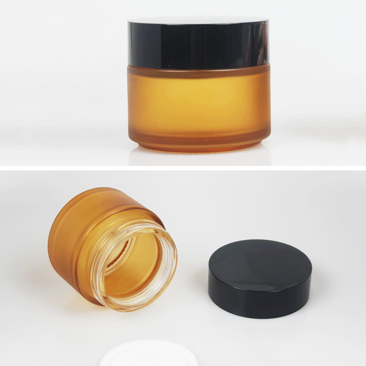 Thick 100ml 3.5oz glass cream jar with black silver cap for cosmetics packaging