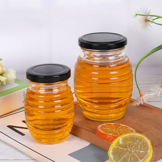 Transparent 380ml 730ml Honeycomb shaped honey glass jar with metal cap