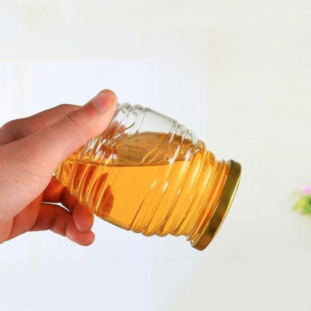 Transparent 380ml 730ml Honeycomb shaped honey glass jar with metal cap