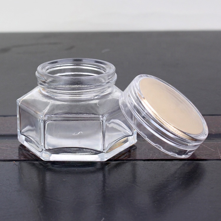 Transparent eye cream glass jar hexagon wholesale glass jar cosmetic with screw caps