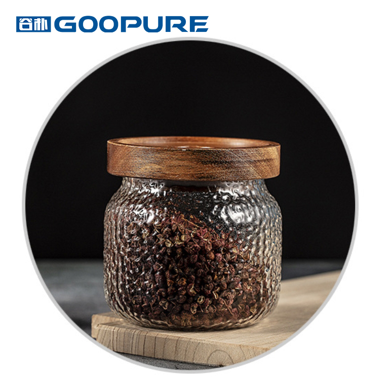 Transparent hammered glass sealed storage jar with acacia wood lid