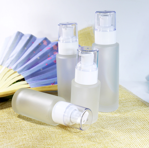 Transparent round pressed liquid foundation bottle emulsion packaging glass bottle