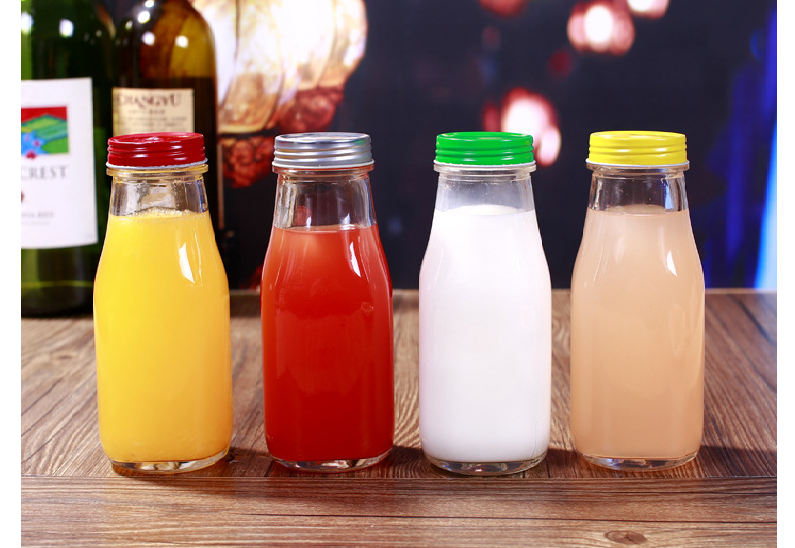 UPC wholesale recycled empty clear glass juice bottle with metal cap