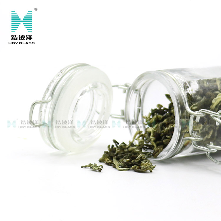 Unique 50ml 75ml 100ml tea food storage glass jar with stainless steel buckle