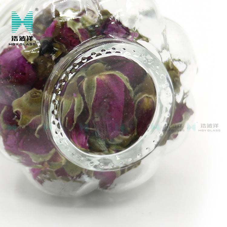 Unique 50ml 75ml 100ml tea food storage glass jar with stainless steel buckle