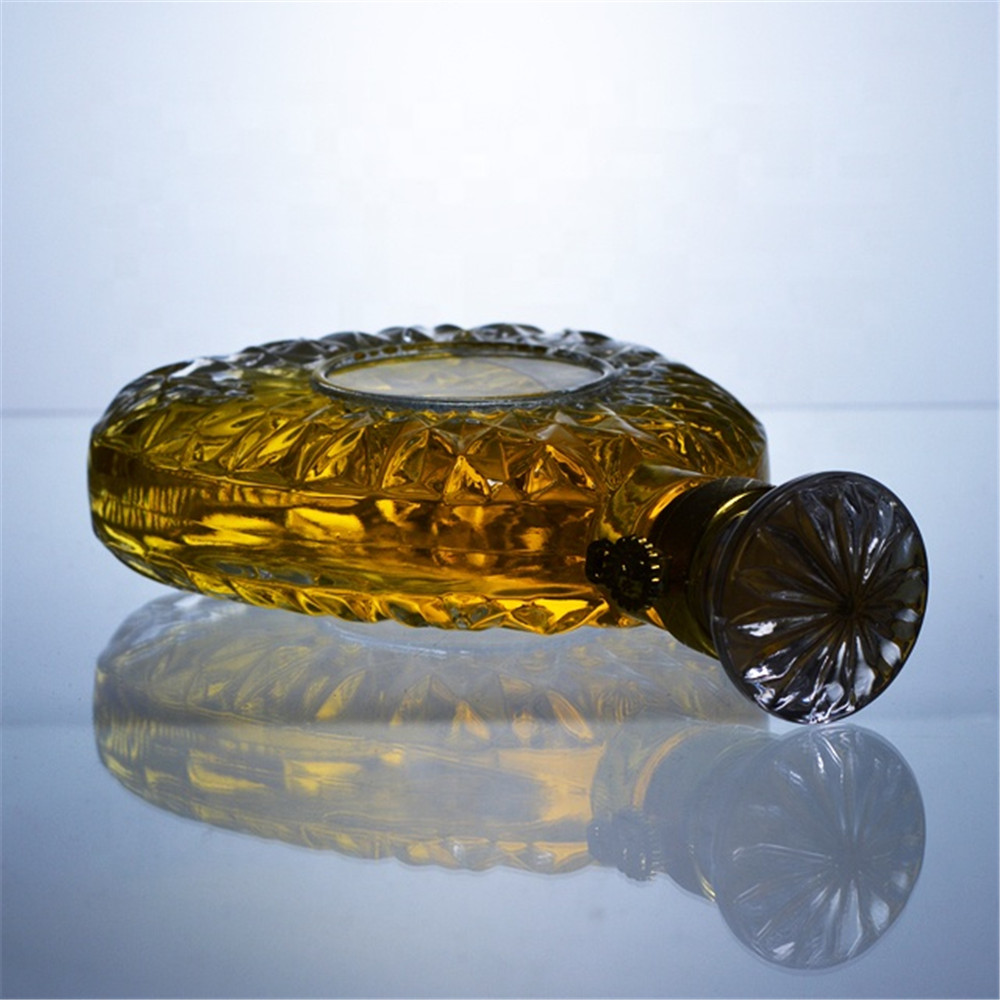 Unique design big embossed glass bottle with metal screw cap 0.5l 1l brandy bottle