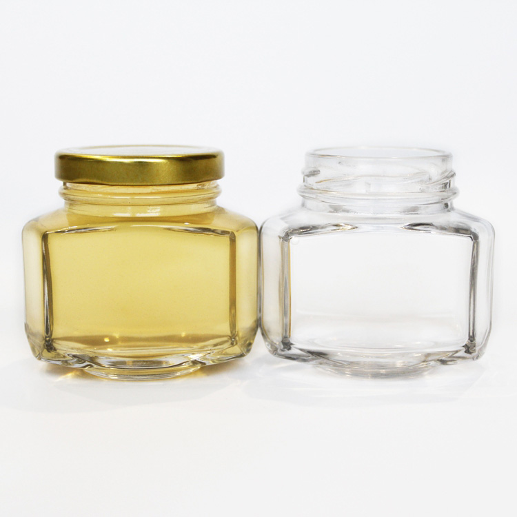 Unique design hexagonal honey packaging jars 150g honey glass bottle with golded lid 110ml