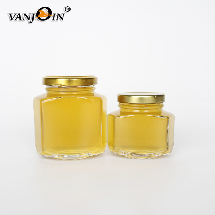 Unique design hexagonal honey packaging jars 150g honey glass bottle with golded lid 110ml