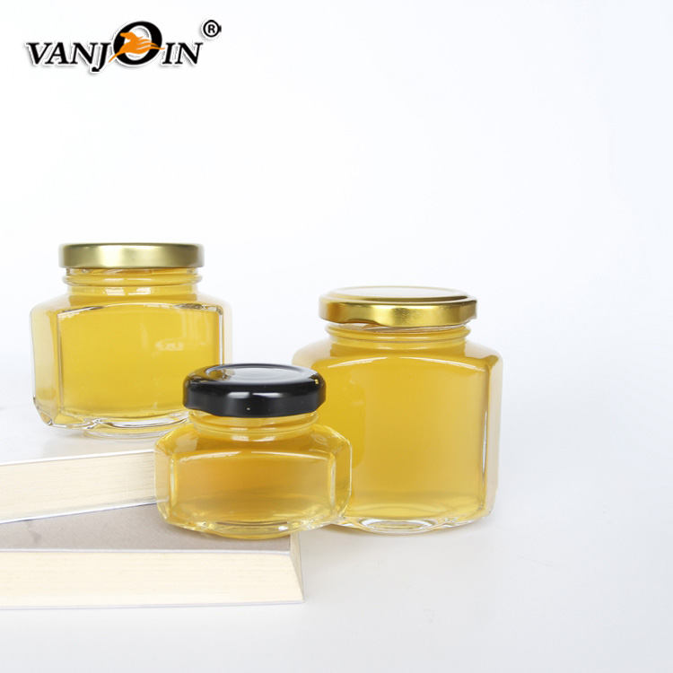 Unique design hexagonal honey packaging jars 150g honey glass bottle with golded lid 110ml