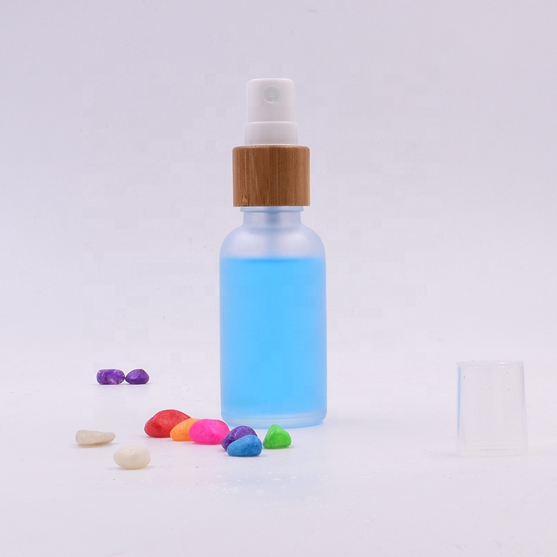 Wholesale  100 ml clear frosted  glass bottle  essential oil perfume  cosmetic packing with plastic white spray