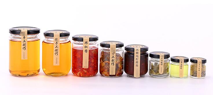 Wholesale 100ml 150ml 190ml 240ml empty round glass honey jam jars with black tinplate lids