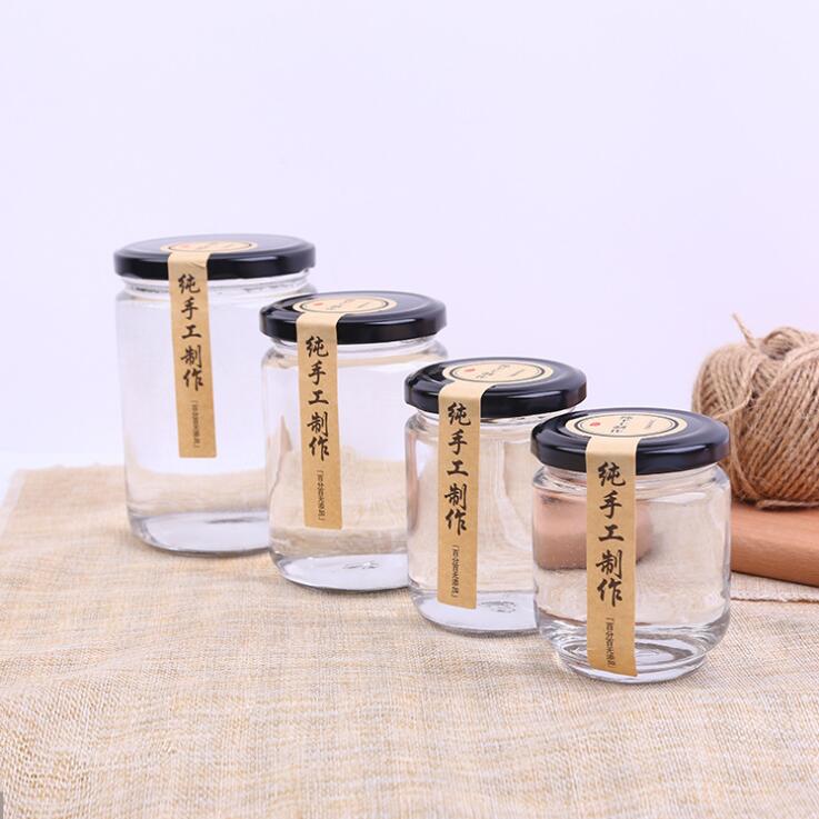 Wholesale 100ml 150ml 190ml 240ml empty round glass honey jam jars with black tinplate lids