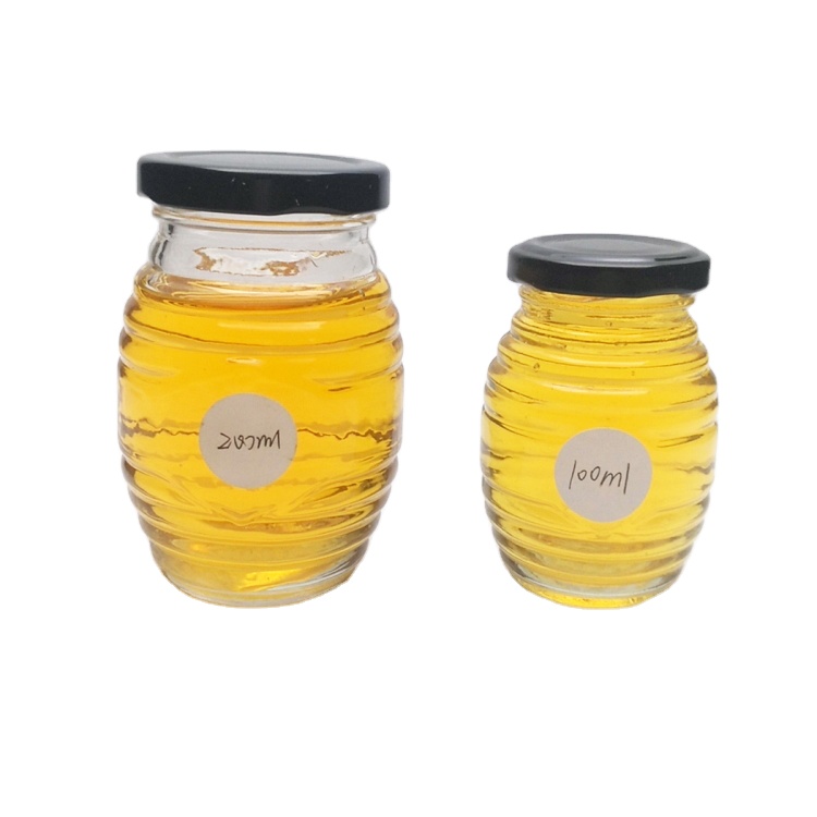 Wholesale 100ml 200ml honeycomb glass honey jar with metal lid
