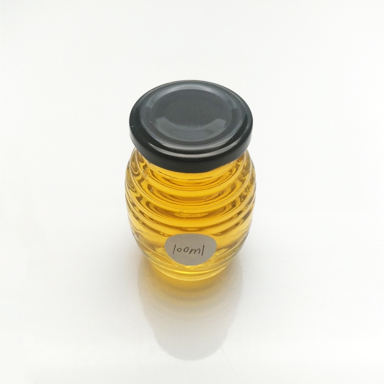 Wholesale 100ml 200ml honeycomb glass honey jar with metal lid