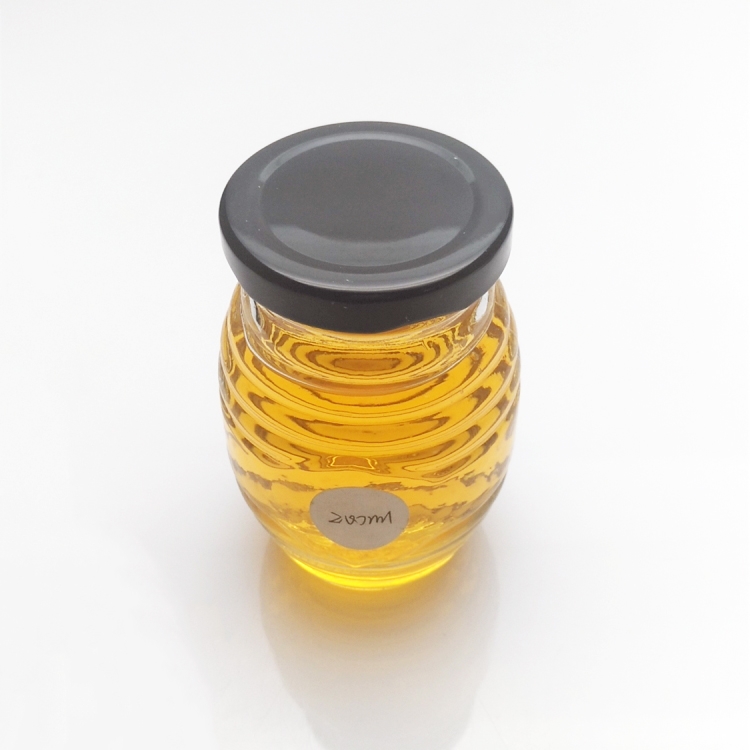 Wholesale 100ml 200ml honeycomb glass honey jar with metal lid