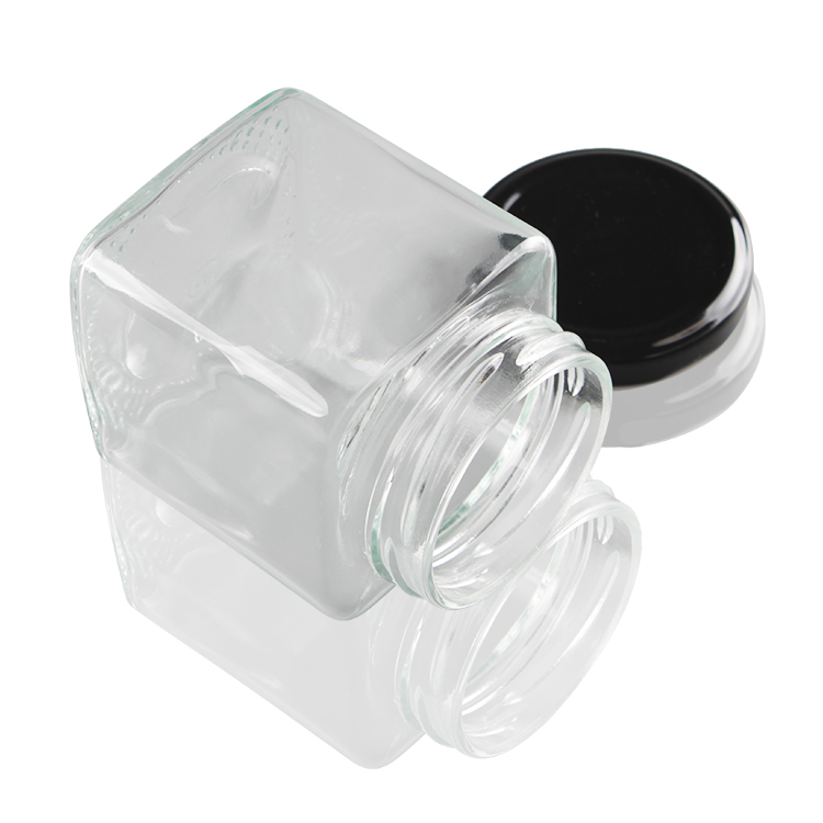 Wholesale 100ml Food Grade Empty Round Clear Mini Jam Honey Glass Jar Small Glass Jars with Black Metal Lid