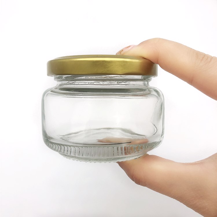 Wholesale 120ml flat glass packaging jar for honey jam peanut butter jar with cap