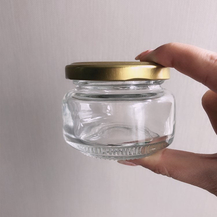 Wholesale 120ml flat glass packaging jar for honey jam peanut butter jar with cap