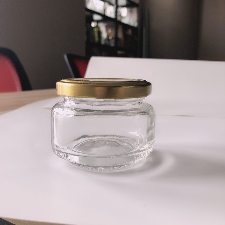 Wholesale 120ml flat glass packaging jar for honey jam peanut butter jar with cap