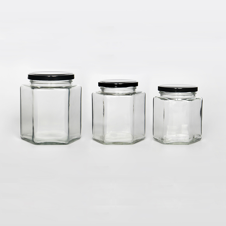 Wholesale 16 oz embossed luxury hexagon honey glass jar empty glass jars for canning with lid