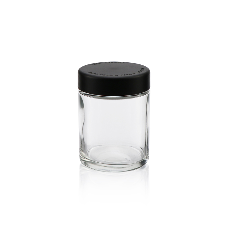 Wholesale 1oz 2oz 3oz 4oz clear candy storage container empty cylindrical child proof food glass jar with dark lid