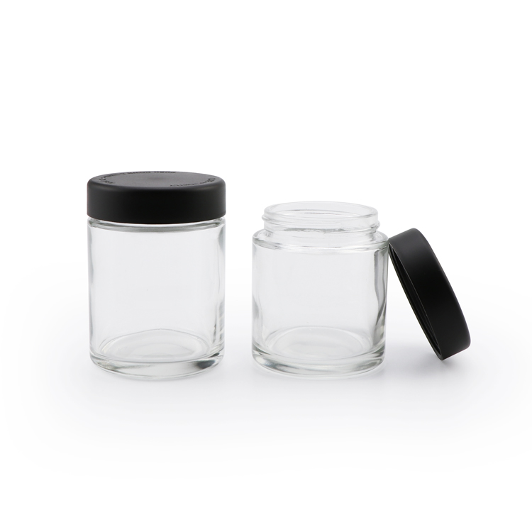 Wholesale 1oz 2oz 3oz 4oz clear candy storage container empty cylindrical child proof food glass jar with dark lid