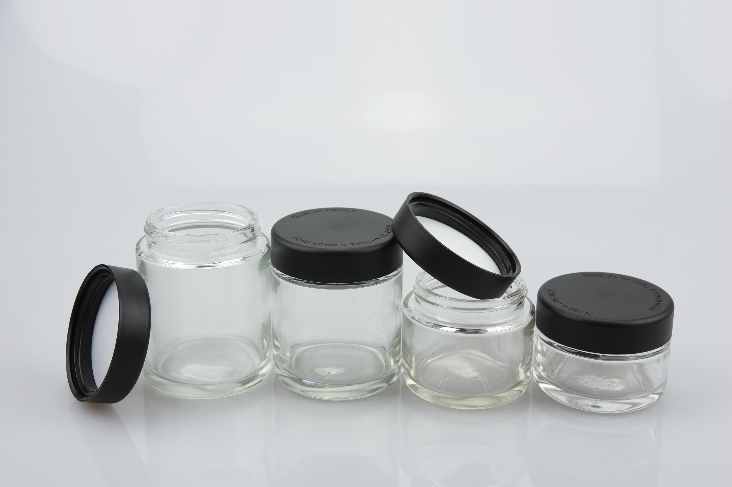 Wholesale 1oz 2oz 3oz 4oz clear childproof cosmetic jars for cream