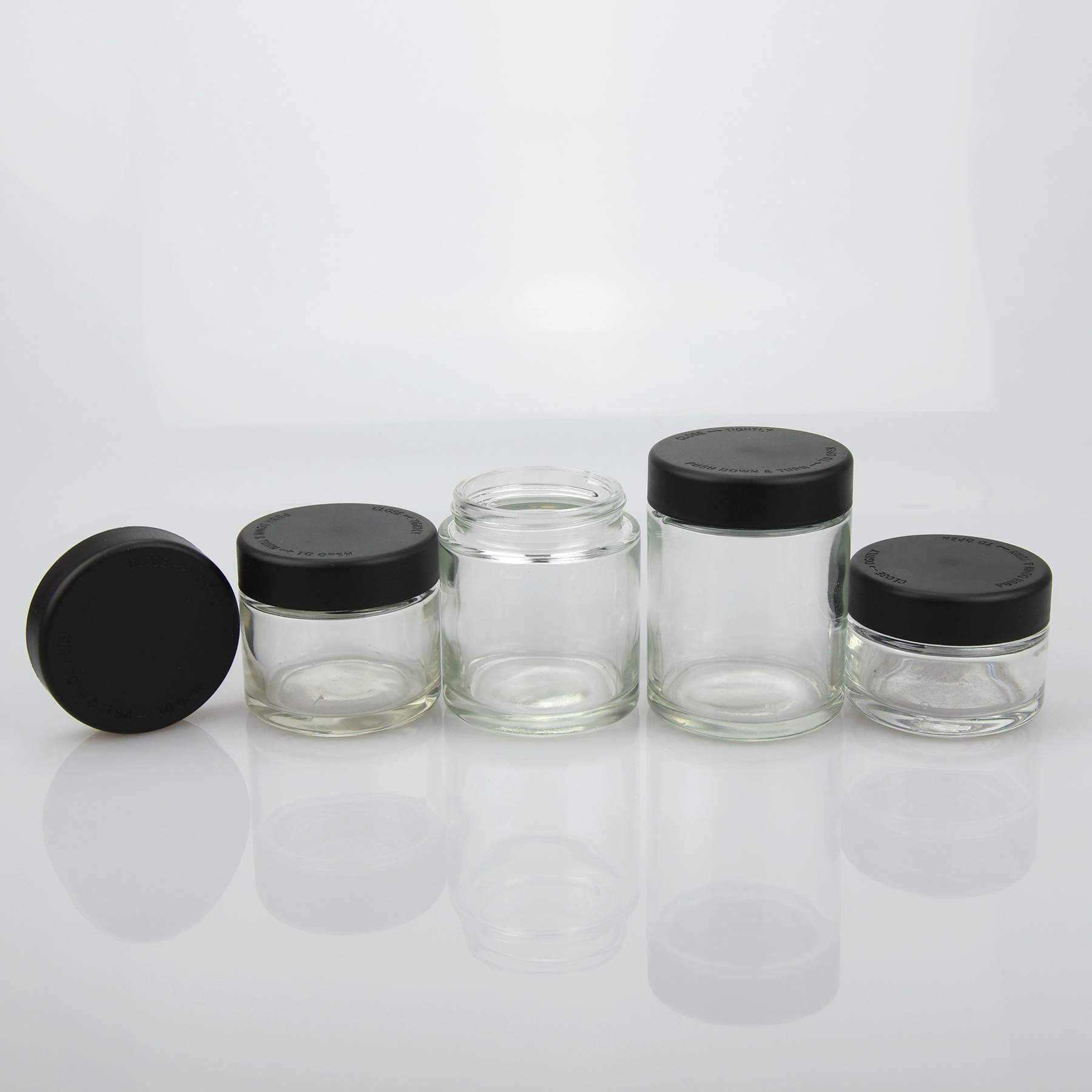 Wholesale 1oz 2oz 3oz 4oz clear childproof cosmetic jars for cream